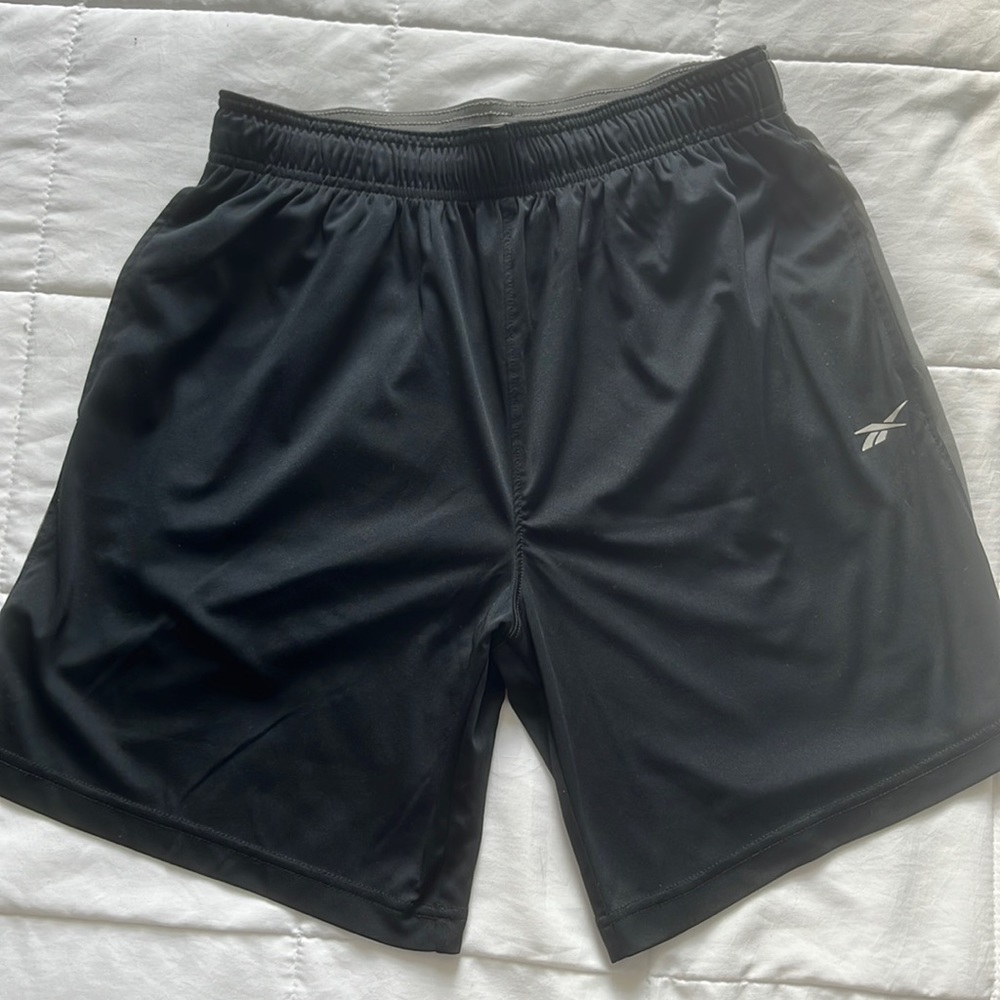Black Reebok shorts, size small